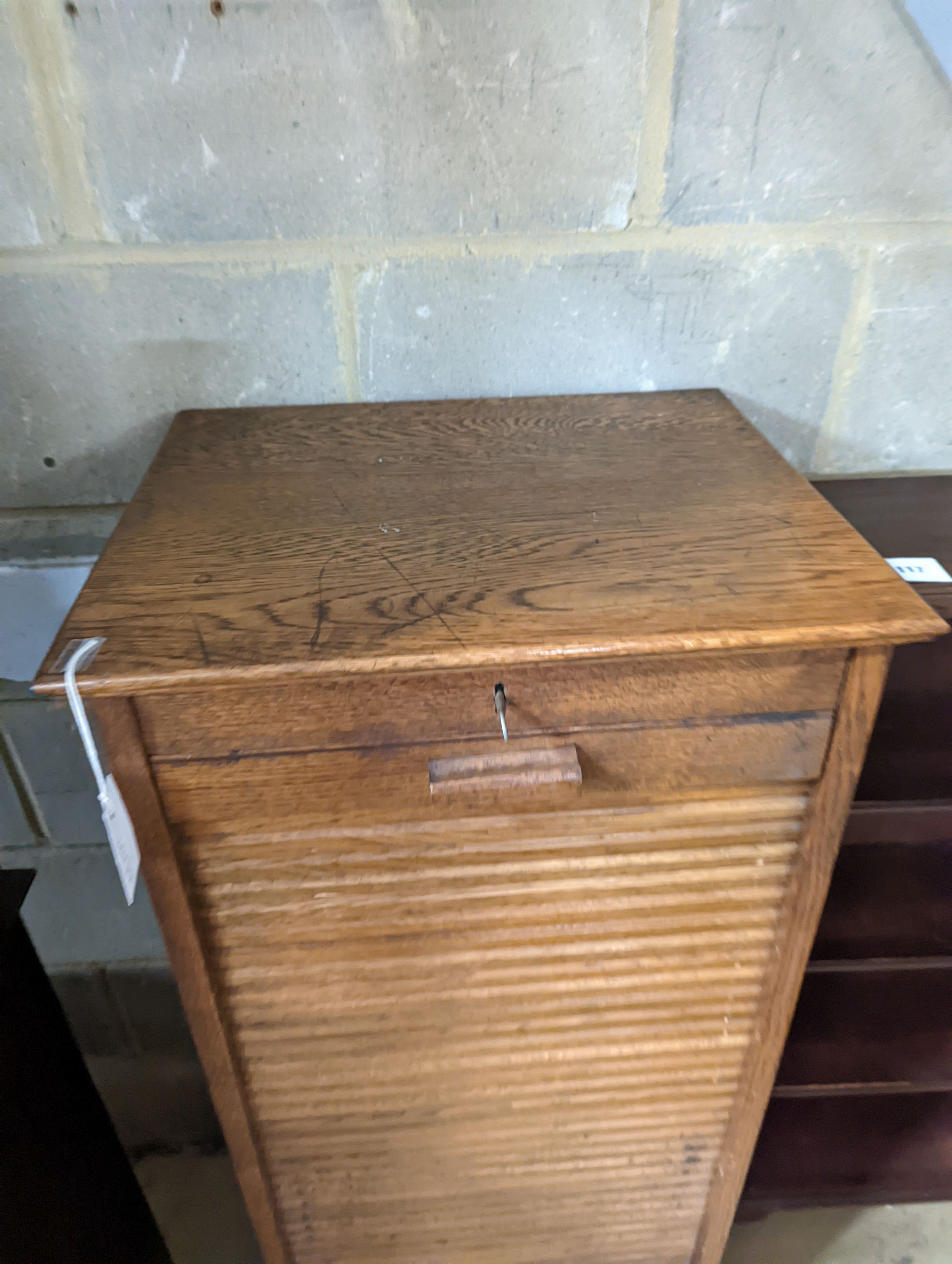 An early 20th century oak tambour filing cabinet, width 49cm, depth 40cm, height 125cm